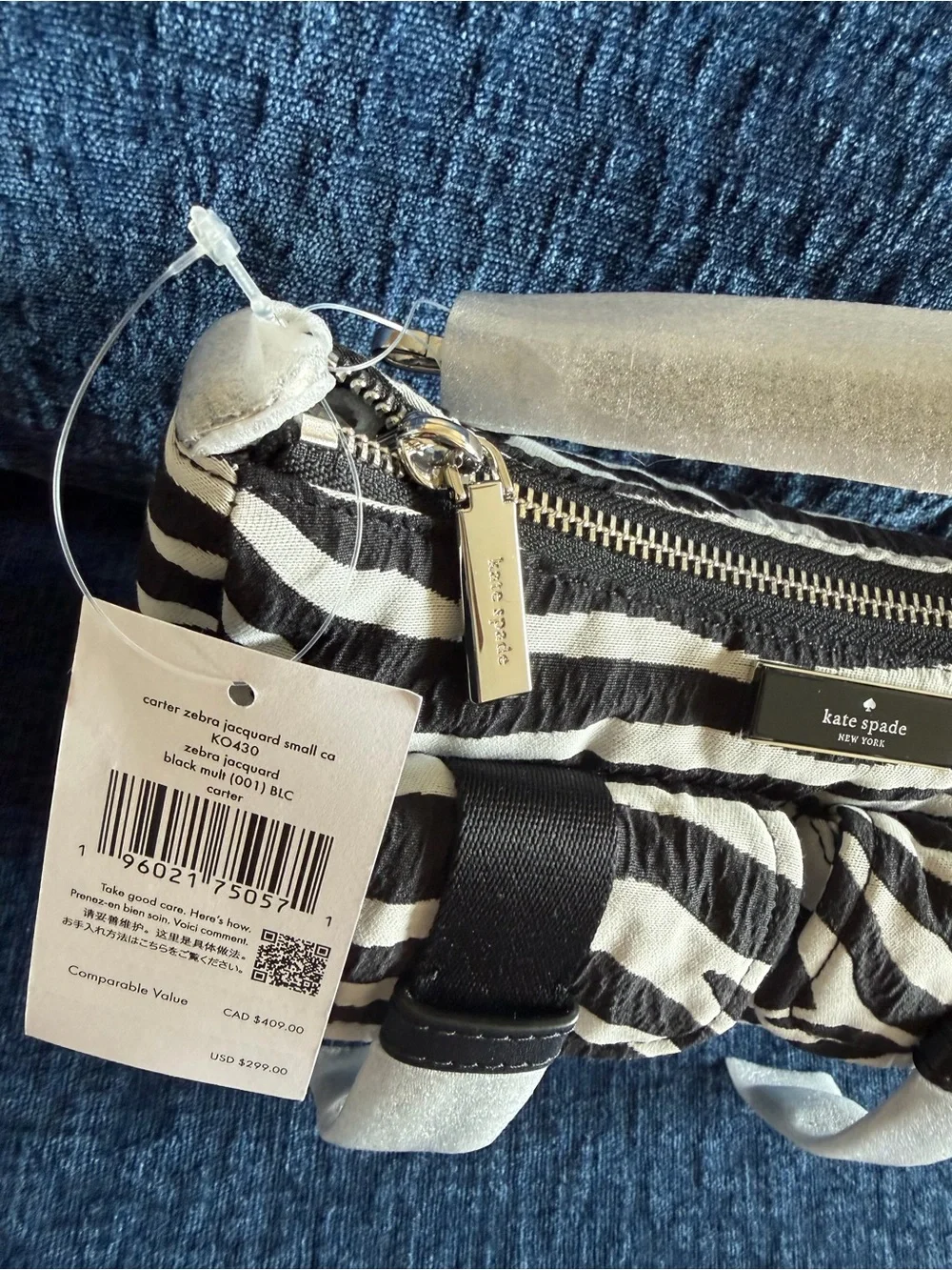 Kate Spade Carter Zebra Cargo Crossbody Bag in black and white